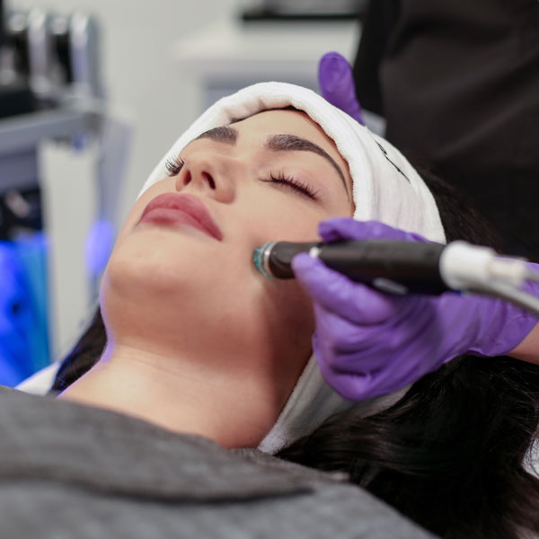 Woman receiving SkinCeuticals facial treatment